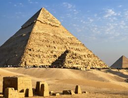 Majestic Great Pyramids of Giza at sunset, highlighting precisely fitted stone blocks and ancient Egyptian architectural splendor.