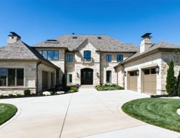 Luxurious modern home with an exterior facade of pristine Kansas limestone, exemplifying its elegance and enduring value.
