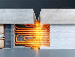 A split-screen conceptual image comparing hydronic and electric underfloor heating systems, showcasing water pipes beneath stone tiles on the left and heating mats beneath ceramic tiles on the right.