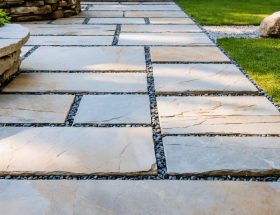 An outdoor space showcasing the classic 3-stone paver pattern with large, medium, and small rectangular stones arranged in a repeating sequence, illustrating the pattern's aesthetic appeal and functionality.