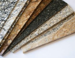 "A selection of granite countertop samples displaying various colors and patterns, illustrating the diverse options available for homeowners considering granite surfaces."