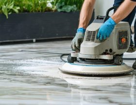 "Professional using advanced diamond grinding equipment to transform a worn marble surface into a high-gloss finish, illustrating modern resurfacing techniques and sustainability."