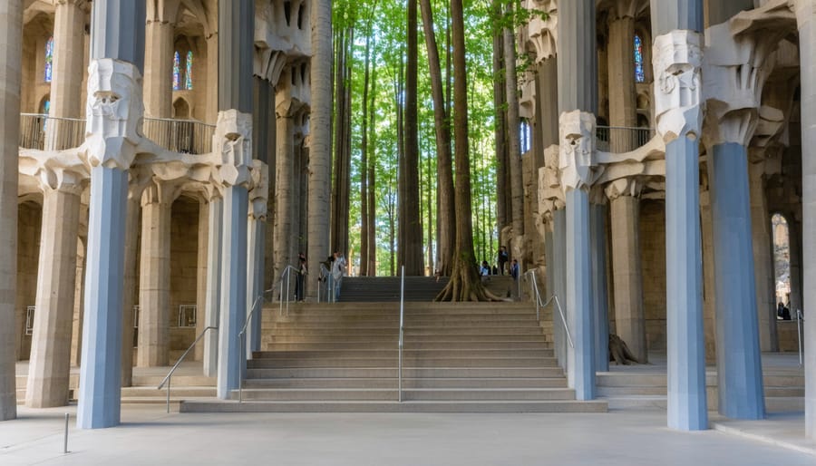 Interior view of Sagrada Familia showing nature-inspired stone columns that branch like trees