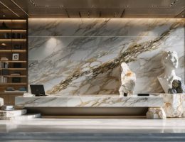 A modern workspace with a marble accent wall, granite desk, and quartzite sculpture, showcasing the use of natural stone to enhance mental performance and create a serene, focused environment.