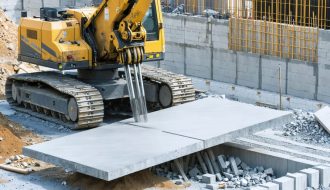 An advanced robotic arm meticulously positioning large stone slabs on a construction site, illustrating the integration of robotics in modern stone installation.