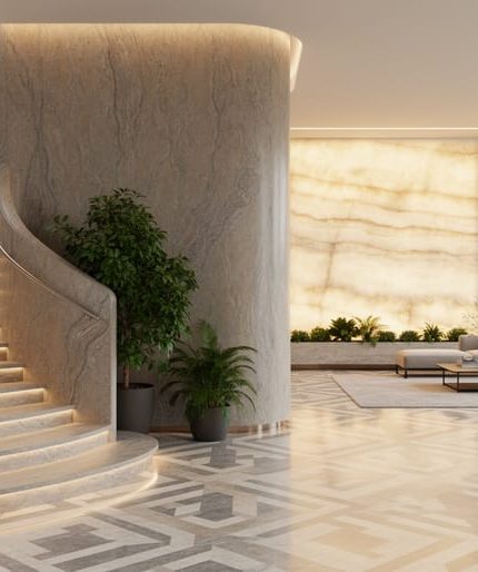 Contemporary interior with a curved sculptural stone partition, backlit translucent onyx wall, radius staircase wrapped in flexible stone veneer, and water-jet patterned marble floor, lit by soft daylight with warm backlighting; minimalist living area and indoor plants in the background.