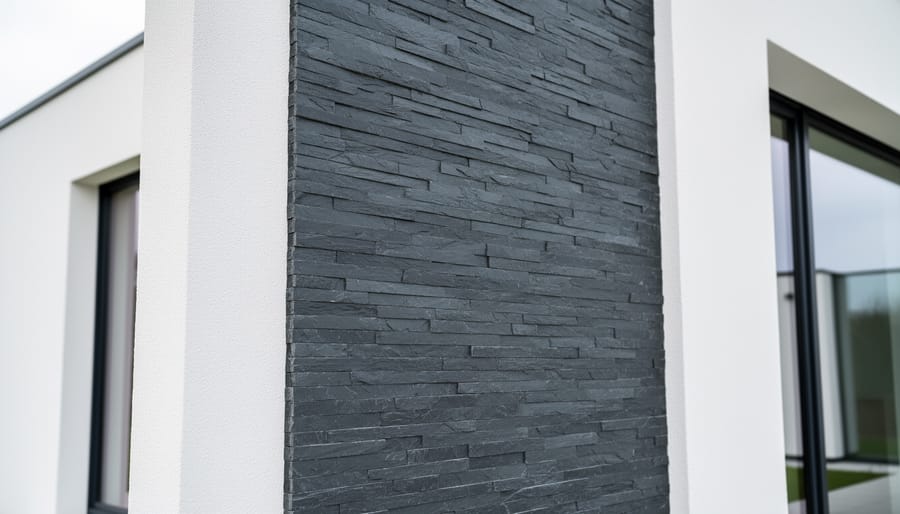 Close-up detail of natural slate stone wall showing layered cleft texture