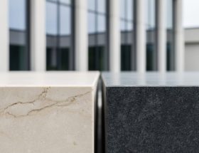Close-up of limestone and granite slabs used in an architectural span, showing stone veining and texture in soft daylight.