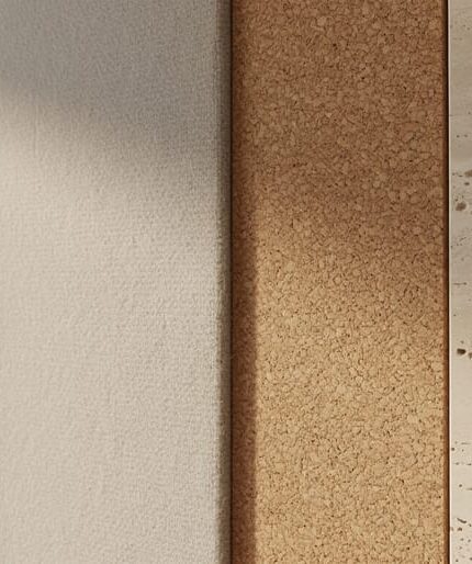 Natural acoustic materials in a modern interior, showing textured wool, cork or wood-fiber panels, and porous limestone/travertine stone surfaces for sound absorption.